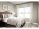 Cozy bedroom with a queen-size bed and large window at 286 Prickly Pear Ct, Lady Lake, FL 32159