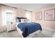 Charming bedroom with navy and white polka dot bedding and pink walls at 286 Prickly Pear Ct, Lady Lake, FL 32159