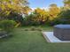 Enjoy nature in this backyard with a patio, a hot tub, and plenty of green space at 2719 Brookline Ave, New Smyrna Beach, FL 32168