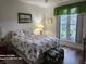 Comfortable bedroom with floral bedding, a window seat and bright, natural light at 2719 Brookline Ave, New Smyrna Beach, FL 32168