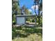 Two car carport with a metal roof and one closed garage door at 2719 Brookline Ave, New Smyrna Beach, FL 32168