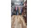 Spacious walk-in closet with wood-style floors, built-in shelving for shoes, and ample hanging space for clothes at 2719 Brookline Ave, New Smyrna Beach, FL 32168