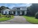 Charming home featuring a well-manicured lawn and a welcoming front porch at 2719 Brookline Ave, New Smyrna Beach, FL 32168