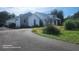 Side exterior view showcasing the well-maintained grounds and exterior details of the property at 2719 Brookline Ave, New Smyrna Beach, FL 32168