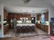 Spacious kitchen with center island and seating, stainless appliances and modern pendant lighting at 2719 Brookline Ave, New Smyrna Beach, FL 32168