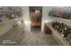 Well-organized pantry features tiled floors, shelving, and a cabinet for storing food, liquor, and other household items at 2719 Brookline Ave, New Smyrna Beach, FL 32168