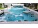 Inviting in-ground spa with jets and clean, clear water at 2719 Brookline Ave, New Smyrna Beach, FL 32168