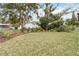 Landscaped backyard with lush lawn and mature trees at 1018 Stetson St, Orlando, FL 32804