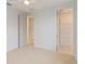 Bedroom with walk-in closet and neutral color palette at 1018 Stetson St, Orlando, FL 32804