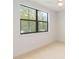 Light bedroom with large window and neutral decor at 1018 Stetson St, Orlando, FL 32804