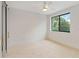 Bedroom with sliding barn door and carpet at 1018 Stetson St, Orlando, FL 32804