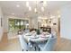 Open concept dining area with a round table, looking toward the kitchen and living room at 1018 Stetson St, Orlando, FL 32804