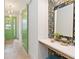 Entryway with green door, floral wallpaper, and a vanity at 1018 Stetson St, Orlando, FL 32804