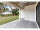 Covered patio with brick flooring and access to backyard at 1018 Stetson St, Orlando, FL 32804