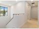 Upstairs hallway with neutral walls and carpet at 1018 Stetson St, Orlando, FL 32804