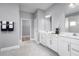 Elegant bathroom boasts double vanity and walk-in shower at 1946 Quail Fields Cir, Winter Haven, FL 33884