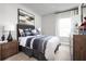 Cozy bedroom with wood dresser and large window at 1946 Quail Fields Cir, Winter Haven, FL 33884