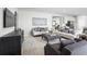 Bright living room featuring comfy seating, a modern coffee table, and an open floor plan at 1946 Quail Fields Cir, Winter Haven, FL 33884