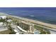 An oceanfront condo building features a community pool, covered parking, and direct beach access at 2390 Ocean Shore Blvd # 1040, Ormond Beach, FL 32176