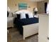Cozy bedroom with beach-themed decor, ample natural light, and tile flooring at 2390 Ocean Shore Blvd # 1040, Ormond Beach, FL 32176