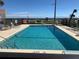 Community pool area with clear blue water with plenty of seating and ocean view at 2390 Ocean Shore Blvd # 1040, Ormond Beach, FL 32176