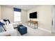 Spacious Gathering room with comfortable seating and a large TV at 3025 Ruby Falls Dr, Deland, FL 32724