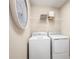 Laundry room with washer, dryer, and shelving for storage at 3025 Ruby Falls Dr, Deland, FL 32724