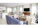 Open concept living area with kitchen, dining, and seating areas at 3025 Ruby Falls Dr, Deland, FL 32724