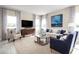 Spacious living room featuring a neutral color palette and ample natural light at 3025 Ruby Falls Dr, Deland, FL 32724