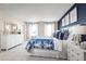 Bright Primary bedroom with a king-size bed and ample closet space at 3025 Ruby Falls Dr, Deland, FL 32724