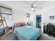 Bright bedroom with a queen bed, built-in window seat, and workspace at 104 Sunset Way, Fruitland Park, FL 34731