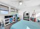 Bedroom with queen bed, built-in window seat, and ample storage at 104 Sunset Way, Fruitland Park, FL 34731