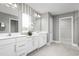 Modern bathroom with double vanity and walk-in shower at 1202 Whispering Ln, Minneola, FL 34715
