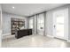 Bright home office with a large desk, built-in shelving, and natural light at 1202 Whispering Ln, Minneola, FL 34715