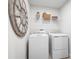 Convenient laundry room with washer, dryer, and shelving at 1202 Whispering Ln, Minneola, FL 34715
