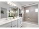 Spa-like bathroom with double vanity, large shower, and modern fixtures at 2105 Aibonito Cir, Clermont, FL 34711