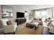 Open concept living area with a neutral color scheme and comfy seating at 2105 Aibonito Cir, Clermont, FL 34711