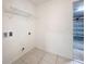 Laundry room with shelving and garage access at 369 St Georges Cir, Eagle Lake, FL 33839