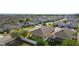 Aerial view showcasing the neighborhood and home with a large, fenced backyard at 2588 Egret Loop, Kissimmee, FL 34743