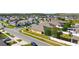 An aerial view of a suburban neighborhood featuring similar homes and manicured lawns at 2588 Egret Loop, Kissimmee, FL 34743