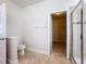 Bathroom featuring tile flooring, shower, toilet, and access to the walk-in closet at 2588 Egret Loop, Kissimmee, FL 34743