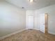 Empty bedroom featuring tile flooring and neutral paint at 2588 Egret Loop, Kissimmee, FL 34743