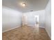 Spacious bedroom with tile floor, neutral paint and entryways into the bathroom and hallway at 2588 Egret Loop, Kissimmee, FL 34743