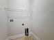Laundry room featuring tile flooring and a wire shelf at 2588 Egret Loop, Kissimmee, FL 34743