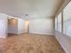 Inviting living room with tile floors, multiple windows, and access to other rooms in the house at 2588 Egret Loop, Kissimmee, FL 34743