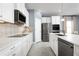 Beautiful kitchen with white cabinets and stainless appliances at 5043 Bear Lake Loop, Deland, FL 32724