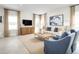 Bright living room with a comfy sofa, two armchairs, modern decor, and large windows at 5043 Bear Lake Loop, Deland, FL 32724