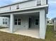 Covered patio with view of backyard and neighboring homes at 260 Crossings Ave, St Cloud, FL 34771