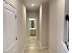 Clean hallway with light neutral paint and tile floors at 260 Crossings Ave, St Cloud, FL 34771