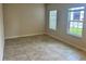 Living room with tile flooring and a window at 260 Crossings Ave, St Cloud, FL 34771